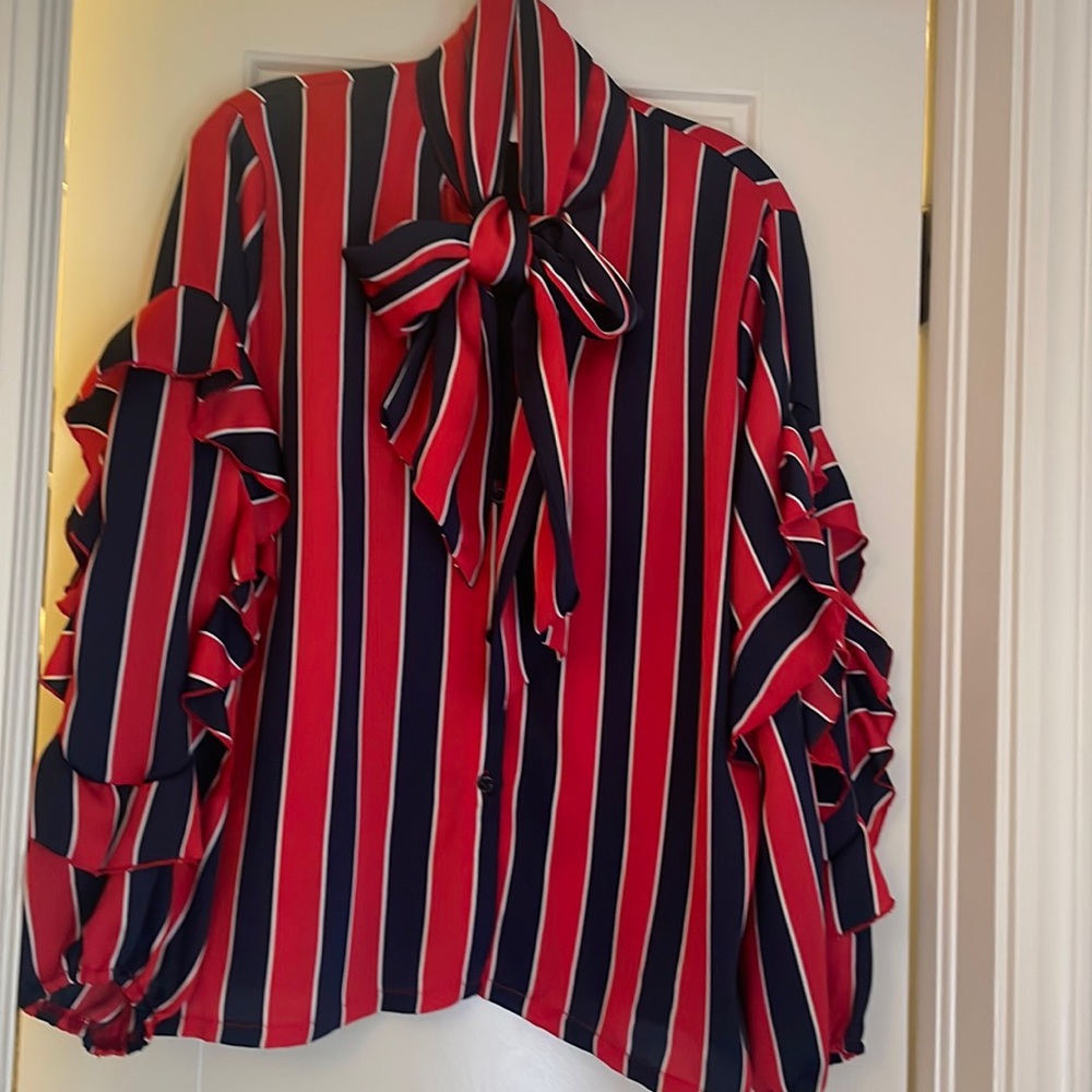 Darling silky blouse with ruffle sleeves and tie at neck!